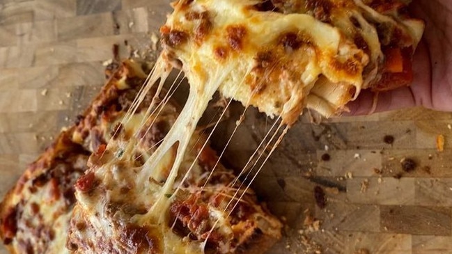 Game changer: Use your leftover bolognese sauce to make garlic bread pizza with our recipe from Taste.com.au