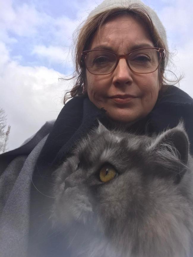 Rachel Lehmann-Ware and one of her three cats at the Ukrainian/Romanian border. Picture Supplied
