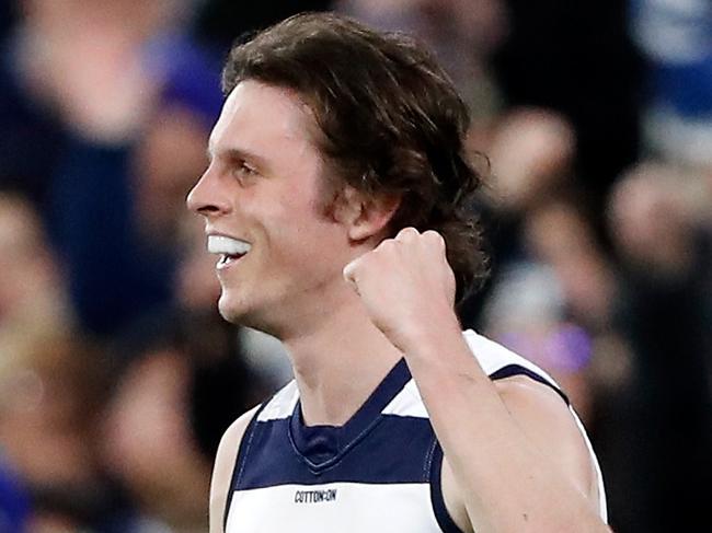 MELBOURNE, AUSTRALIA - SEPTEMBER 16: Max Holmes of the Cats celebrates a goal during the 2022 AFL First Preliminary Final match between the Geelong Cats and the Brisbane Lions at the Melbourne Cricket Ground on September 16, 2022 in Melbourne, Australia. (Photo by Dylan Burns/AFL Photos via Getty Images)