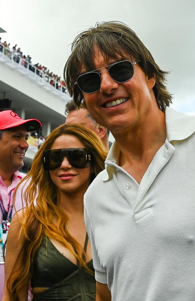 Tom Cruise and Colombian singer Shakira at the Miami GP. (Photo by CHANDAN KHANNA / AFP)