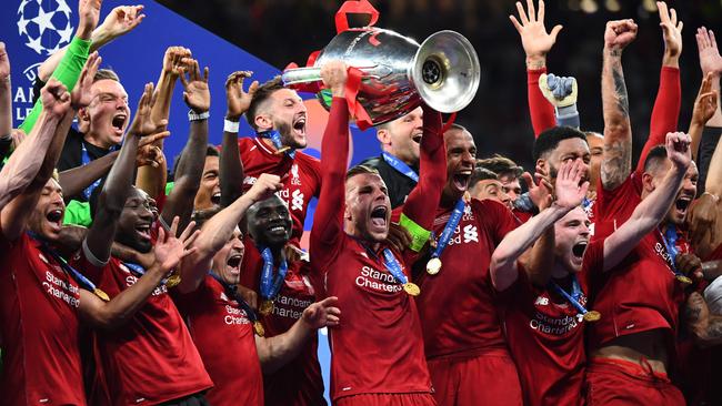 Liverpool’s Jordan Henderson lifts the trophy after victory over Tottenham in the European Champions League final in Madrid last June. Picture: AFP