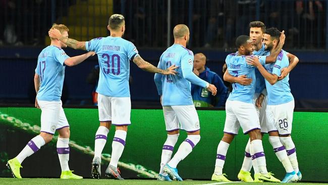 Manchester City’s Algerian midfielder Riyad Mahrez (right) celebrates with teammates after scoring a goal during the UEFA Champions League Group C football match against FC Shakhtar Donetsk. Picture: AFP
