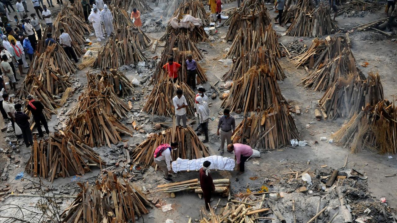 Funeral pyres are prepared for people killed by coronavirus at a mass cremation site in New Delhi. Picture: Imtiyaz Khan/Anadolu Agency via Getty Images