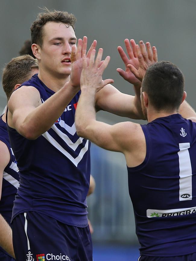 Brennan Cox and Hayden Ballantyne of the Dockers celebrate a goal against Adelaide. Picture: Paul Kane/Getty Images