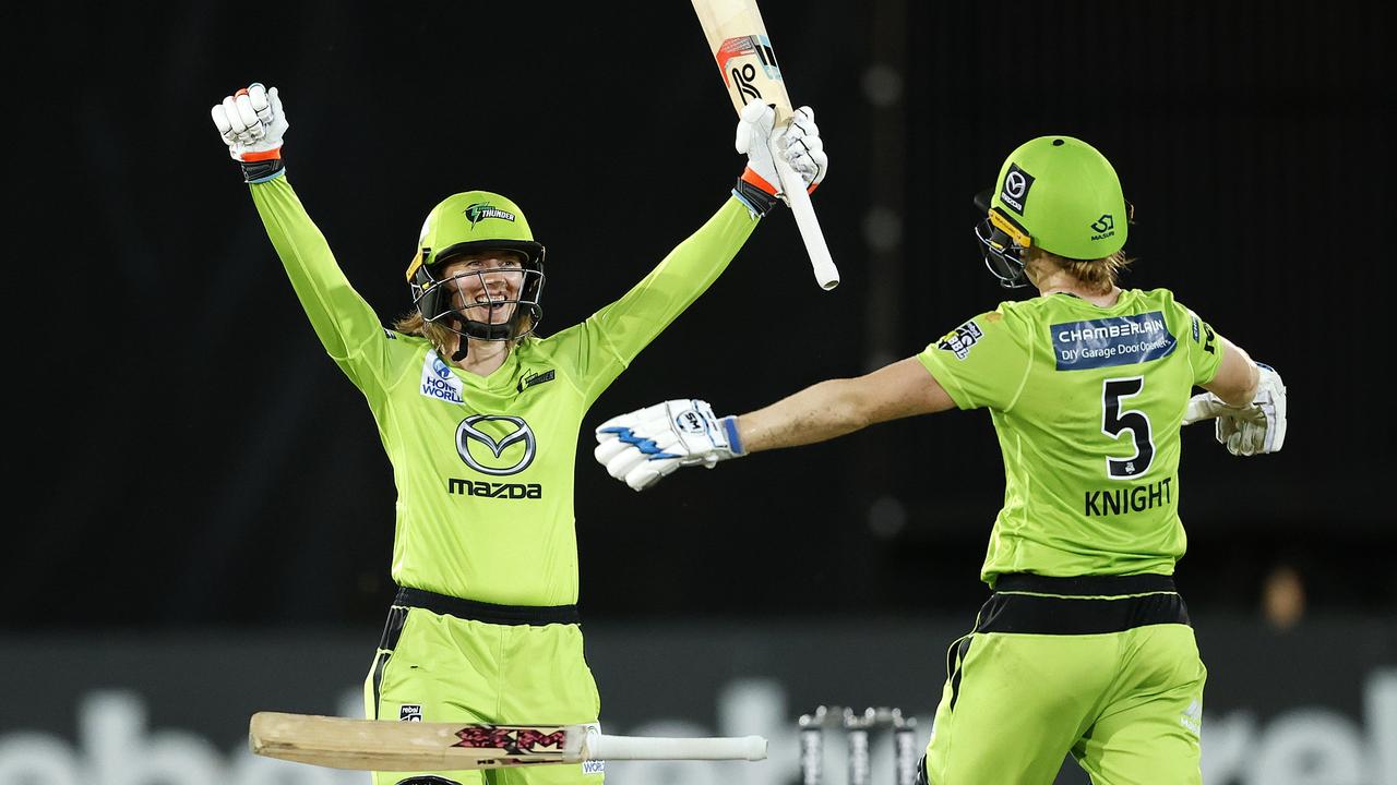 Thunder's Rachael Haynes (left) celebrates the side’s WBBL championship win last season. Picture: Phil Hillyard