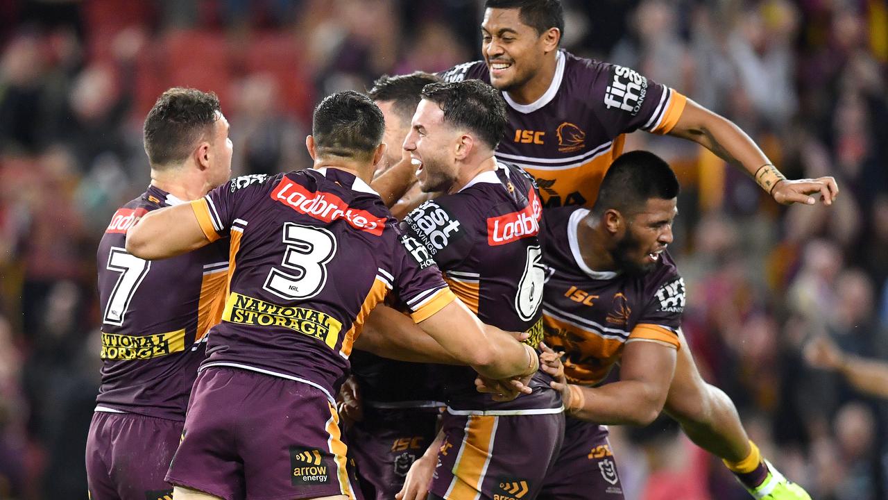 Broncos players celebrate after Jamayne Isaako kicked the golden point winning field goal against the Eels.