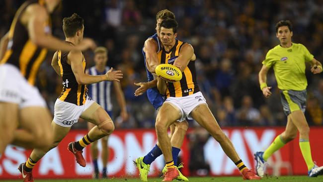 Shaun Higgins was caught by this Ryan Burton bump. Picture: AAP Images