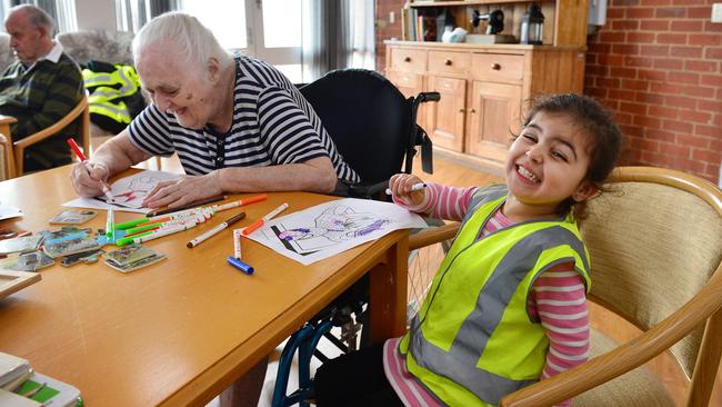 Barbara and young Kayla enjoy some colouring in. Picture: Nicki Connolly