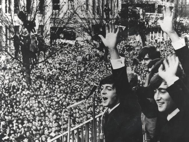 The Beatles made a famous trip to Melbourne, waving to enormous crowds outside the Southern Cross Hotel.