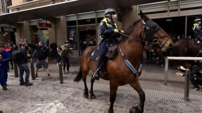 The photographs show the four men near the horse and female police officer between 1pm and 2pm during the wild scenes on George Street, in Sydney’s CBD. Picture: NSW Police