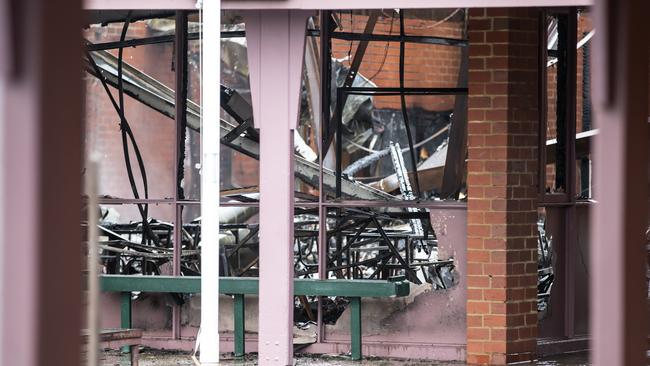 Frames of tables and chairs all the remain intact inside classrooms. Picture: Sarah Matray