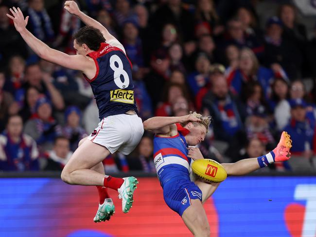 Jake Lever collects Cody Weightman in a spoiling attempt. Picture: Mark Stewart