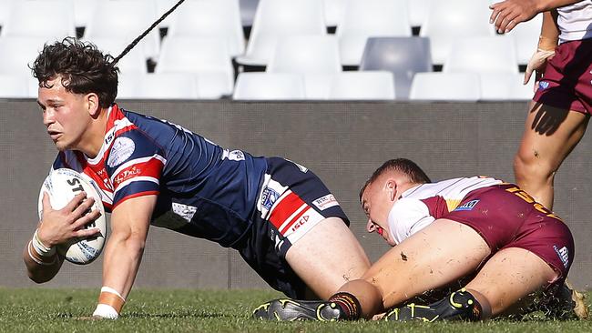 Camden winger Kienan Power -Tempest is tackled by Mitch New. Picture: John Appleyard