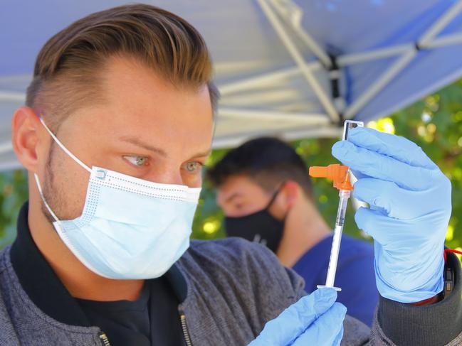 NEW YORK, NEW YORK - OCTOBER 21: A VIP StarNETWORK medical staff member prepares a Pfizer-BioNTech coronavirus (COVID-19) vaccine at a #VAXTOSCHOOL pop-up site at Life of Hope Center on October 21, 2021 in New York City. Gov. Kathy Hochul announced yesterday the opening of 25 new coronavirus (COVID-19) vaccination pop-up sites in an initiative to help increase vaccination rates among school-aged New Yorkers. The Department of Health is working alongside local county health departments, community-based organizations, and healthcare centers to install these sites in different regions of the state. According to the state COVID-19 vaccine tracker, since October 18, 62 percent of 12 to 15-year-olds and 72 percent of 16 to 25-year-olds have received at least one coronavirus vaccine dose.   Michael M. Santiago/Getty Images/AFP == FOR NEWSPAPERS, INTERNET, TELCOS & TELEVISION USE ONLY ==