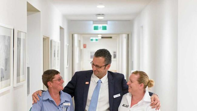 FOR THE TEAM: Kym Eckersley (left) and Rebecca Mathieson congratulated by CEO Whiddon Group Chris Mamarelis after winning national aged care awards. Picture: Adam Hourigan Photography