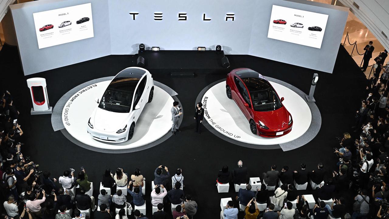 Tesla has had a rough ride on the share market in recent months. Photo: Lillian SUWANRUMPHA / AFP