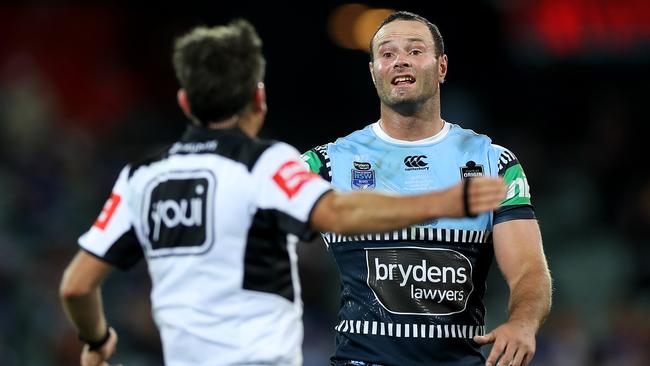 Boyd Cordner of the Blues talks to referee Gerard Sutton