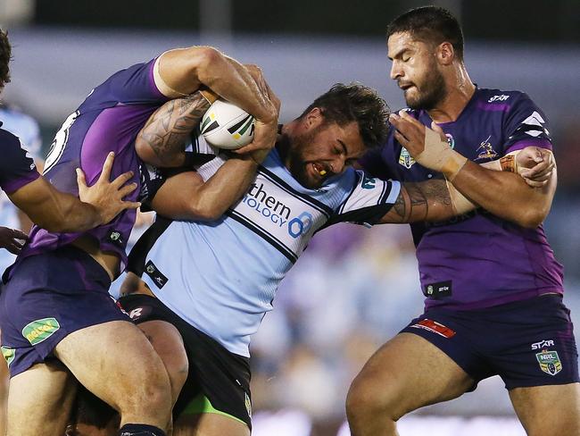 Andrew Fifita is swarmed by Storm defenders.