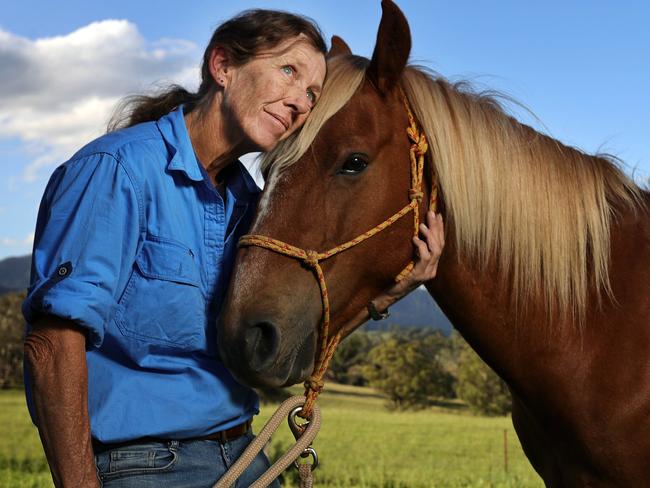 Cathy Healy lost her home in the bushfires of New Year’s Eve 2020. If her horse, Lochie, hears fire sirens his ears will still prick up and he will come to Cathy. Picture: NCA NewsWire/Gary Ramage