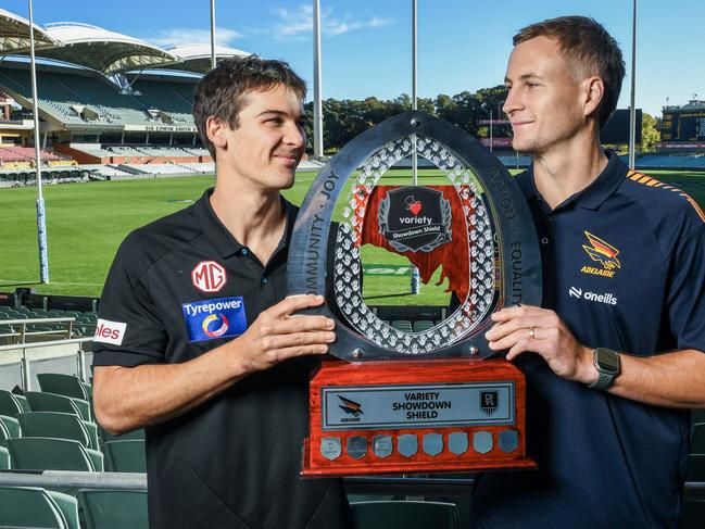 ADELAIDE, AUSTRALIA - MAY 05: Captains Connor Rozee of the Power and Jordan Dawson of the Crows hold the Variety Shield during the AFL Showdown media opportunity at Adelaide Oval on May 05, 2025 in Adelaide, Australia. (Photo by Mark Brake/Getty Images)
