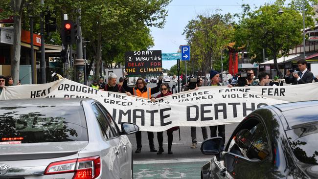 ... and then briefly blocked the road. Picture: AAP Image/David Mariuz