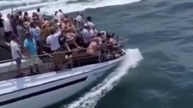 Shocking vision has emerged of a harbour cruise with dozens of passengers – many elderly – pushing the front of the boat almost down to water level.