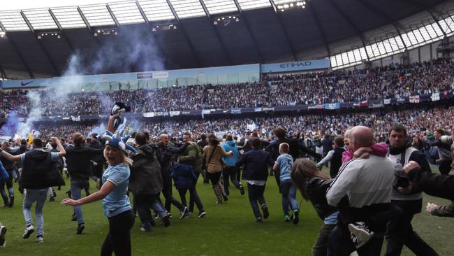 Fans flocked onto the pitch at the final whistle.