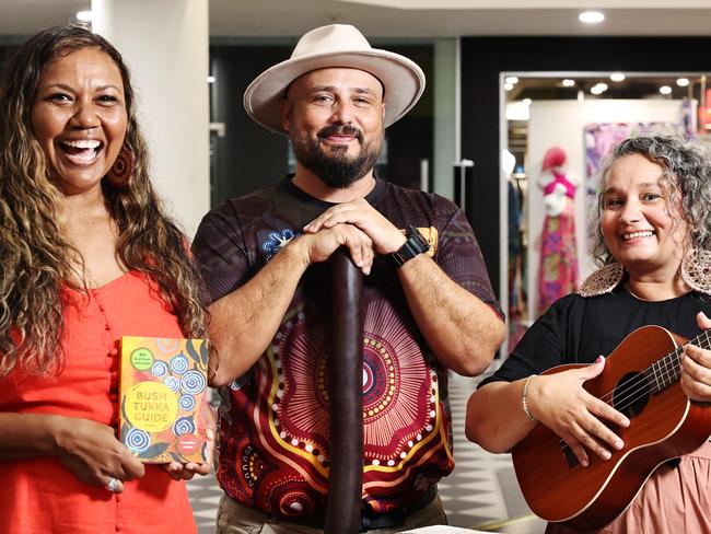 The Cairns Indigenous Business Expo will return to The Pier Shopping Centre for a third consecutive year, with this year's expo featuring interstate exhibitors for the first time. Bush Tukka woman Samantha Martin, event organiser Marc Harbrow and Merindi Schrieber from the Briscoe Sisters admire the artwork of Lorna Jackson, a Northern Territory desert artist who will be selling her work at this year's Cairns Indigenous Business Expo. Picture: Brendan Radke