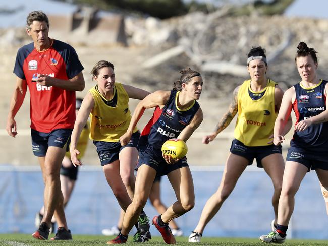 10/12/18 - AFLW - Behind the Scenes with the Adelaide Football Club AFLW team at West Lakes. Matthew Clarke watches Chelsea Randall handpass. Picture SARAH REED