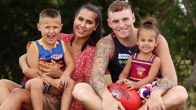 Brisbane’s Mitch Robinson with partner Emma MacNeill and children Charli and Chance. Picture: Liam Kidston.