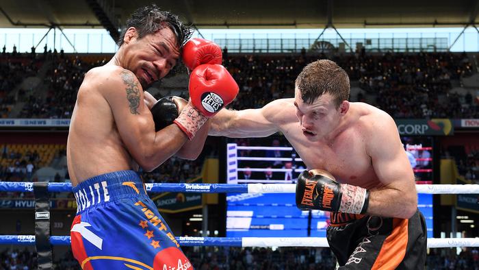 Jeff Horn of Australia (right) strikes Manny Pacquiao of the Philippines.