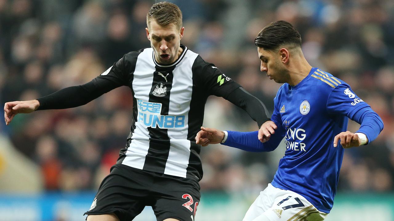 Florian Lejeune of Newcastle United battles for possession with Ayoze Perez of Leicester City