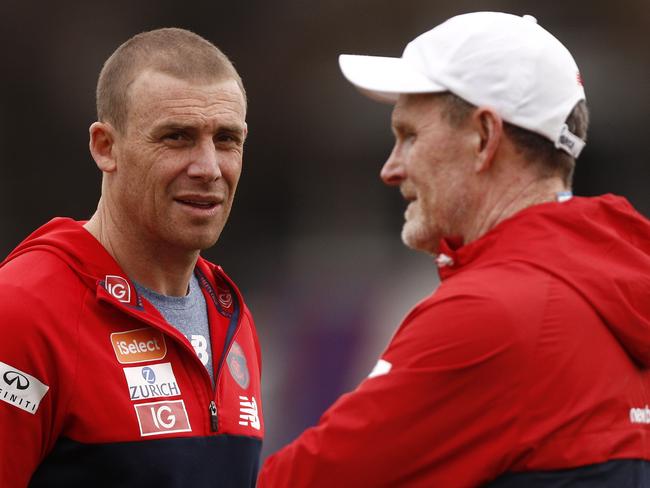 Demons head coach Simon Goodwin (left) talks to assistant coach Brendan McCartney during a Melbourne Demons training session at Gosch's Paddock in Melbourne, Monday, September 10, 2018.  (AAP Image/Daniel Pockett) NO ARCHIVING