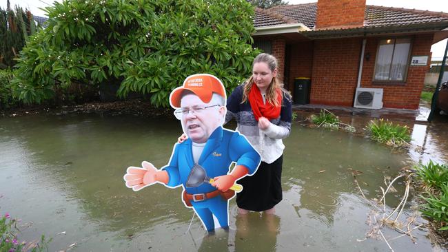 Substitute Ian visits a burst water main at the home of Chelsea Pister in Woodville North earlier this week. Pic: Tait Schmaal