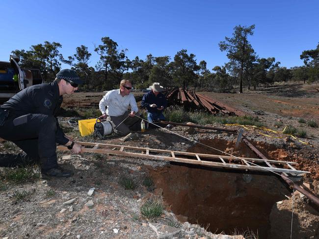 The search team spent the day locating and inspecting mine shafts and wells on the property for Tanja's remains. Photo: Naomi Jellicoe