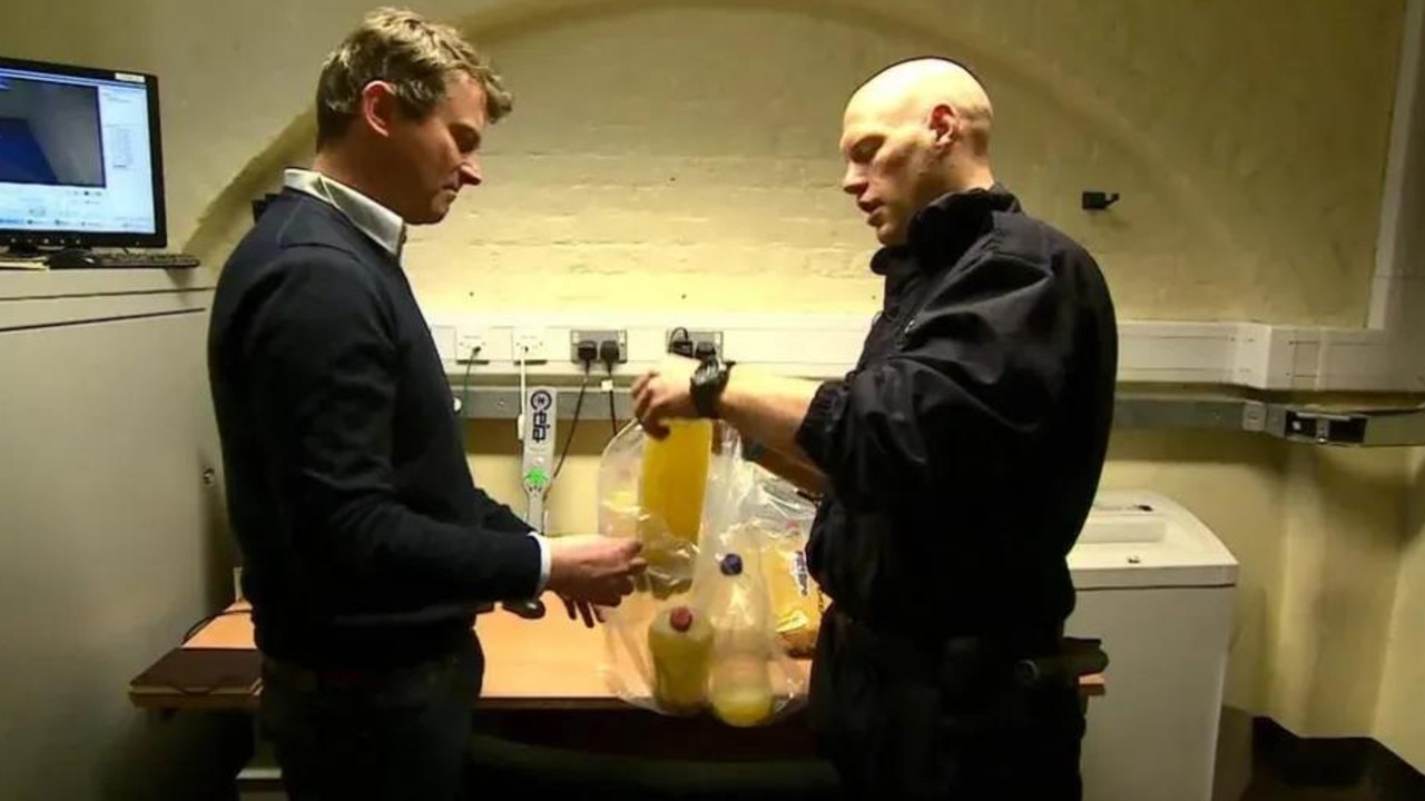 Contraband booze is seized by an officer in a BBC documentary. Credit: BBC