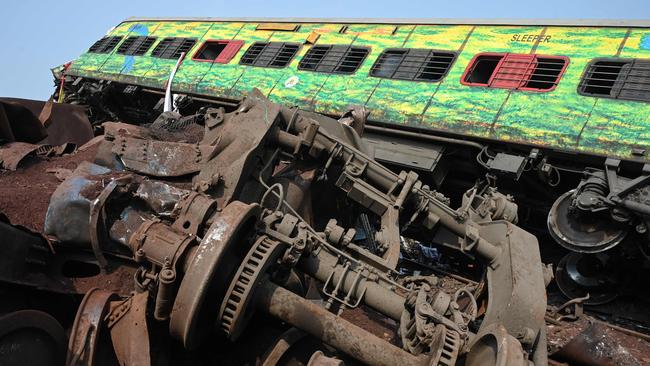 A damaged carriage is seen among wreckage at the accident site of a three-train collision near Balasore. Picture: AFP