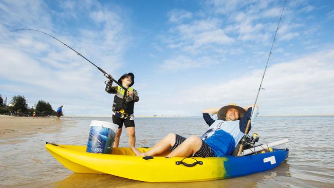 Hayden Rothman, 9, from Capalaba making the most of the clear weather fishing with dad Sandon in the Pumicestone Passage at Caloundra.