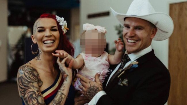 The heavily tattooed couple with their young daughter.