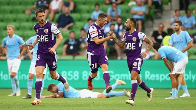 Perth Glory’s Diego Castro, right, celebrates after his late equaliser at AAMI Park left Melbourne City players stunned. Picture: Getty Images