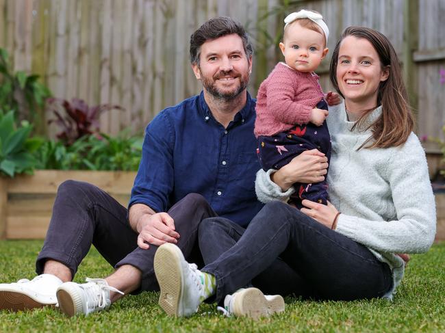 Daniel Mortensen and Julie Davaine, with daughter Margaux, 1, at the Bondi unit they are selling mid-lockdown. Picture: Justin Lloyd