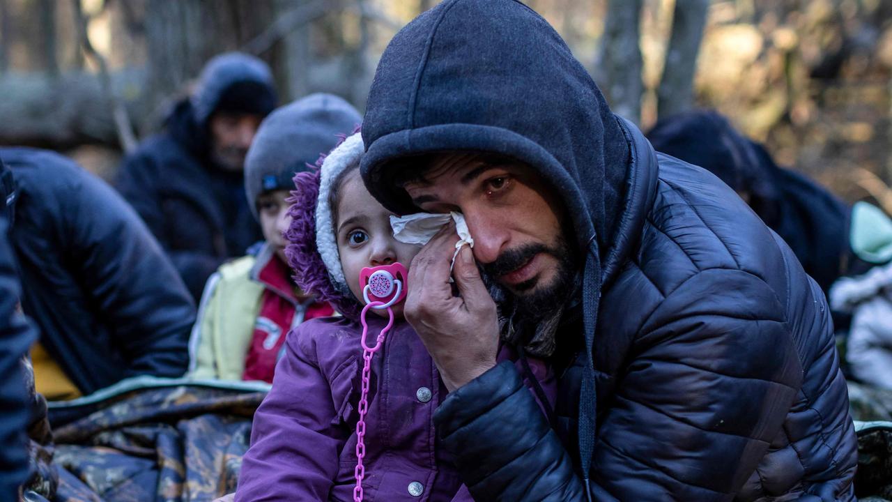 The photo series reveals this Kurdish family’s desperate plight at the Polish/Belarus border. Picture: Wojtek Radwanski/AFP