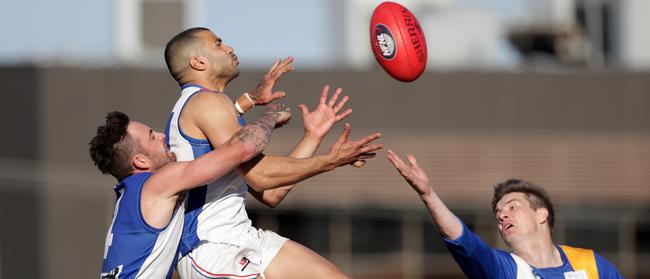 Ahmed Saad flies for a mark as Macleod defender Hayden Seivers attempts to spoil.