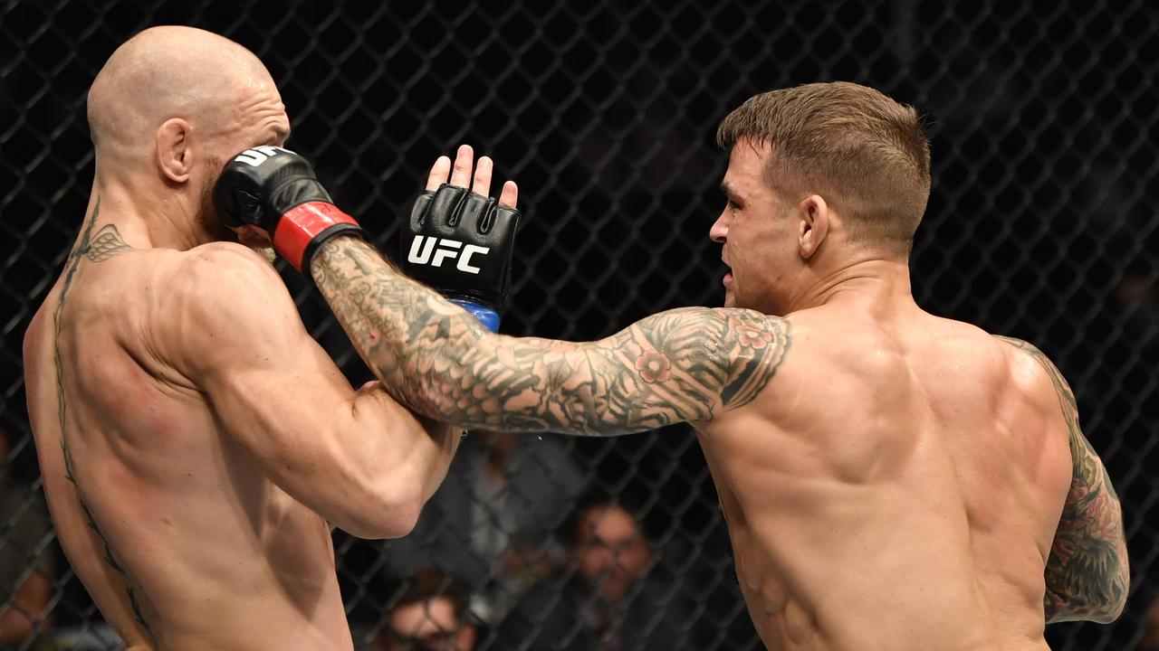 Dustin Poirier punches Conor McGregor in their lightweight fight during the UFC 257 event inside Etihad Arena on UFC Fight Island on January 23.