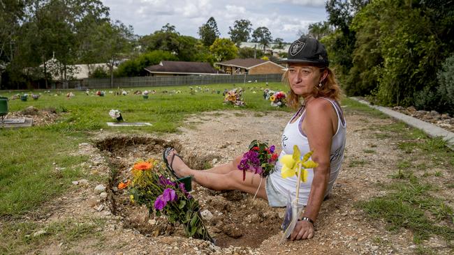 Susan Kelly said it was inexcusable that her 18-year-old son's grave had been allowed to sink so far down she can nearly touch it. Picture: Jerad Williams