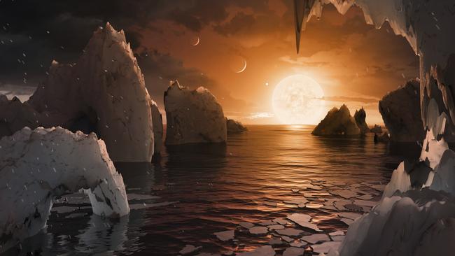 This image provided by NASA/JPL-Caltech shows an artist's conception of what the surface of the exoplanet TRAPPIST-1f may look like, based on available data about its diameter, mass and distances from the host star. The planets circle tightly around a dim dwarf star called Trappist-1, barely the size of Jupiter. Three are in the so-called habitable zone, where liquid water and, possibly life, might exist. The others are right on the doorstep. (NASA/JPL-Caltech via AP)