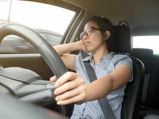 Asian glasses woman boring bad traffic jam on rush hours, Business woman driving a car. exhausted, tired for overworked concept. Picture: eggeeggjiew