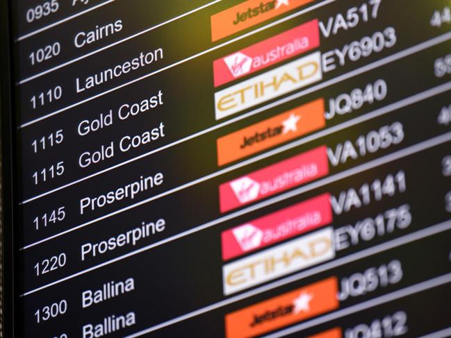 SYDNEY, AUSTRALIA - NCA NewsWire Photos JANUARY, 28, 2021: A flight departure board showing flights to Queensland cities is seen at Sydney Domestic Airport, Sydney. Queensland has announced that it will open its border to NSW on February 1, with Greater Sydney no longer being declared a COVID-19 hotspot. Picture: NCA NewsWire/Bianca De Marchi