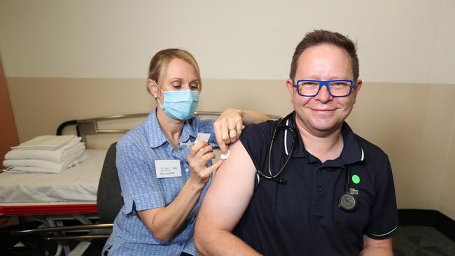 Nurse Alison Clancy gives Associate Professor Paul Griffin an AstraZeneca vaccine at the Mater Hospital. Picture: Annette Dew