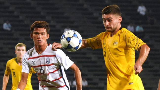 Australia's Ivan Vujica in action against Cambodia. Pic: AFP